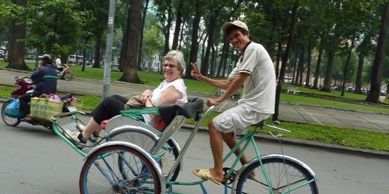 Morning Cyclo Tour of Saigon Markets Temples and Local Life