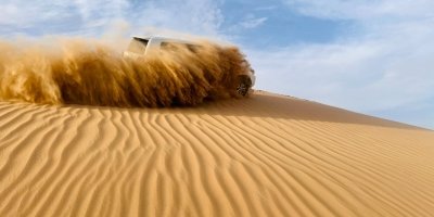 Abu Dhabi Morning Desert Safari with Camel Ride & Sandboarding