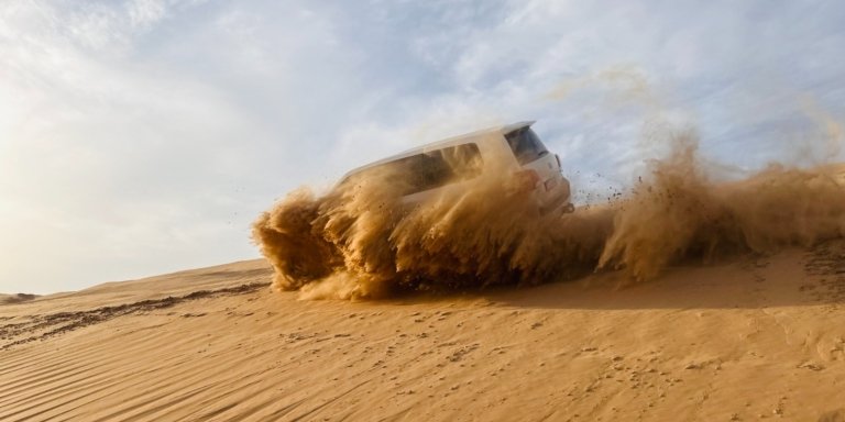 Morning Desert Safari Abu Dhabi with Camel Ride and Sandboarding