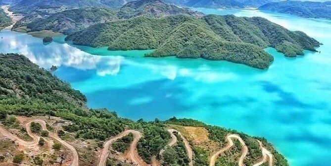 The Sapphire Heart of the Mountains: Bovilla Lake and Mount Gamti